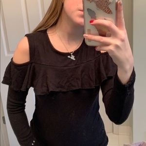 Cut shoulder long sleeve black top with ruffle.